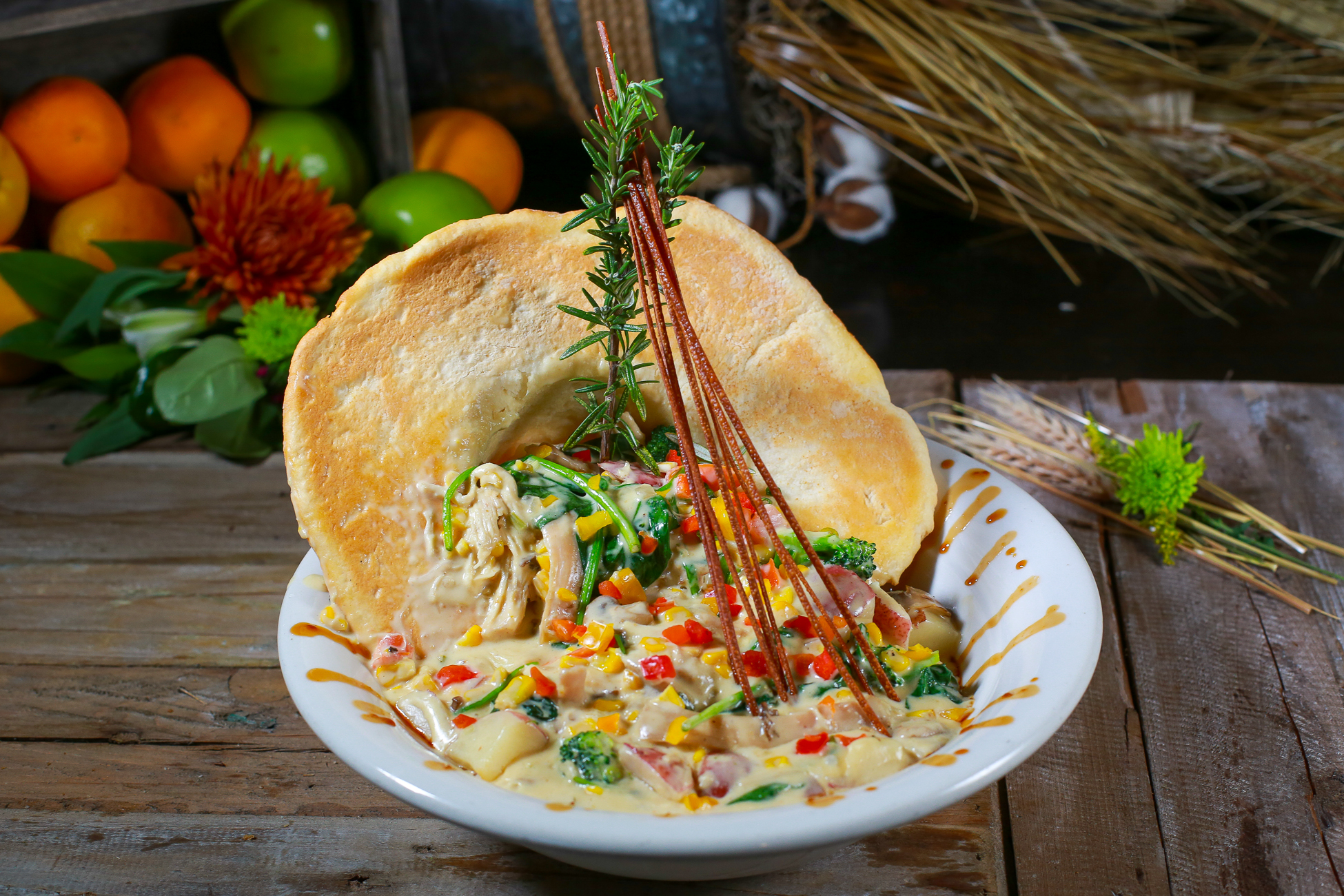 Chefs-crafted roasted chicken pot pie at Hash House A Go Go Winter Garden—topped with a flaky crust and fresh rosemary.