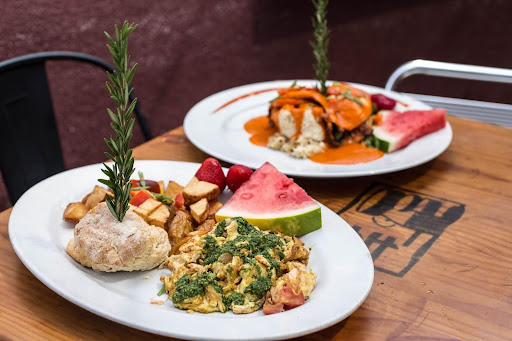 Top 5 Comfort Foods at Hash House A Go Go That You Need to Try 2 Farm-style breakfast with scrambled eggs, biscuit, potatoes, and watermelon at Hash House A Go Go Winter Garden
