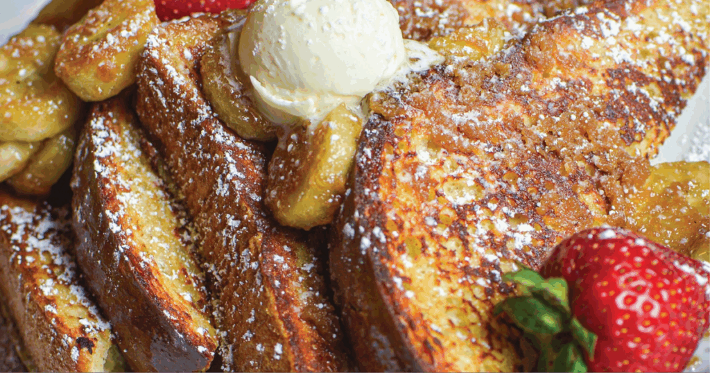 Comfort Food with a Twist: Seasonal Favorites You Can Only Get at Hash House Flamingo 1 Banana-stuffed French toast topped with whipped cream and strawberries at Hash House Flamingo Crossings